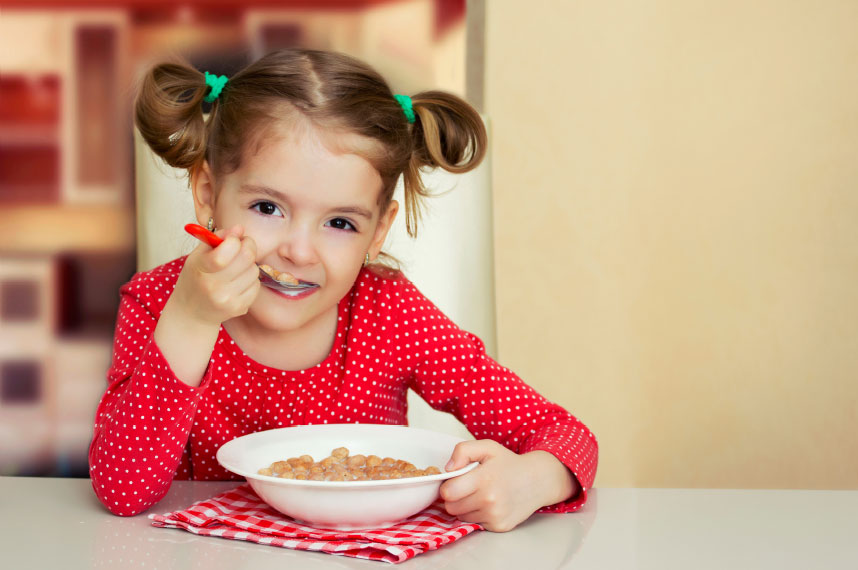 Girl eating bowl of cereal