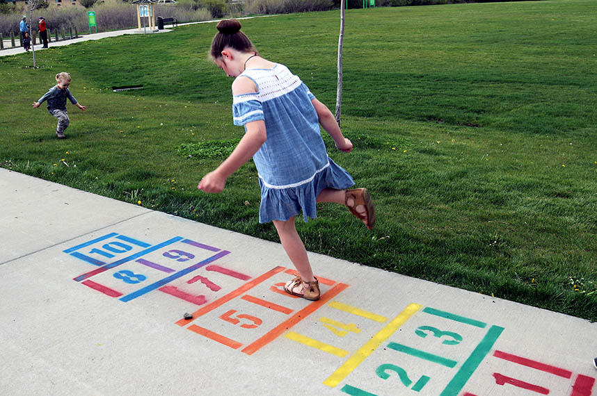 Girl playing hopscotch