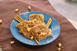 recipe on blue plate with scattered pretzels and peanuts