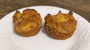 two baked muffins on a white plate
