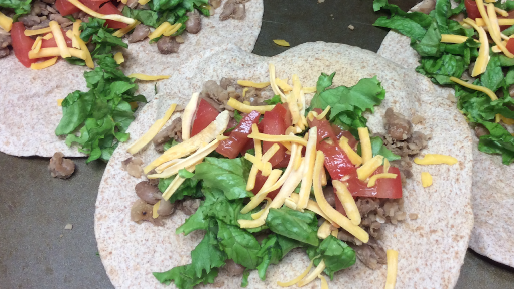 beans and toppings on baked tortillas