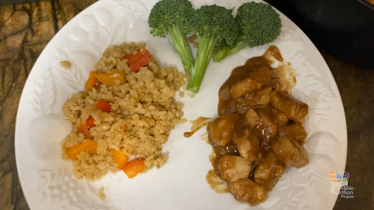 serving of chicken with fried rice and broccoli on a plate