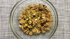 snack mix in glass bowl on placemat