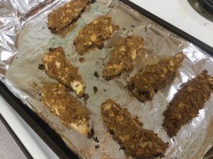 baked chicken on cookie sheet