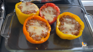 Yellow and orange peppers stuffed with lentils, rice, and melted low-fat cheese.