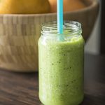 Green smoothie in glass jar.