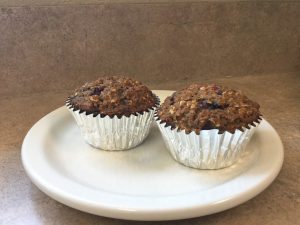 Two muffins on a white plate