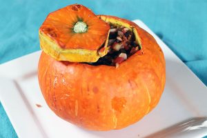 Small orange squash stuffed with beans and rice