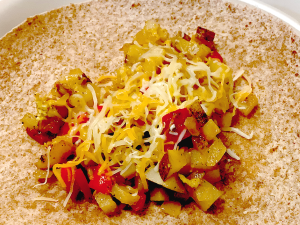 Unfolded burrito on plate