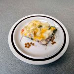 Plate with a slice of chicken shepherd's pie on it