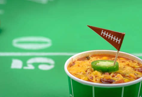 bowl of chili with football flag topper on 50 yard line