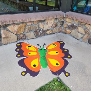 Butterfly stencil painted on the sidewalk