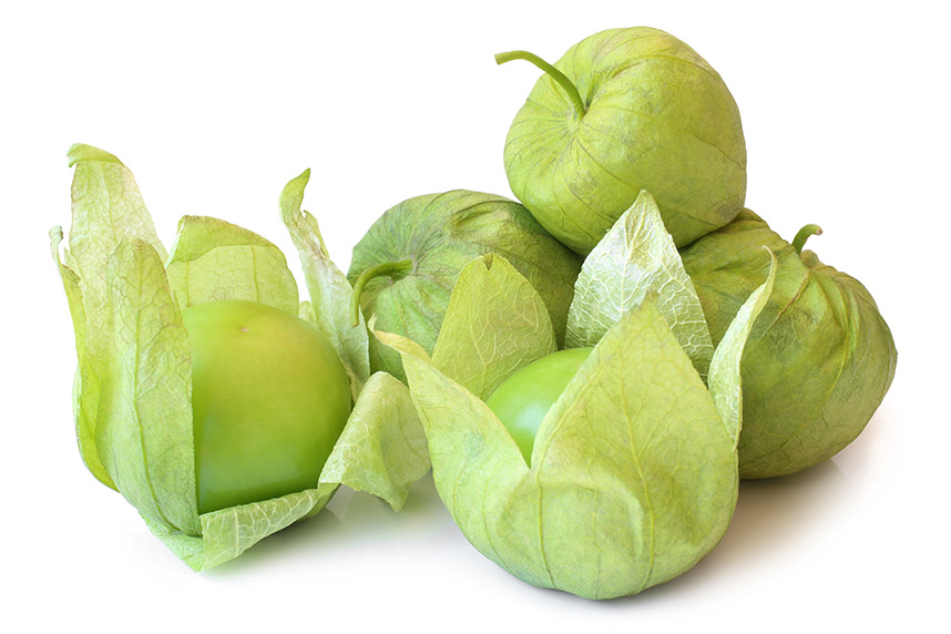 Green tomatillos in a pile