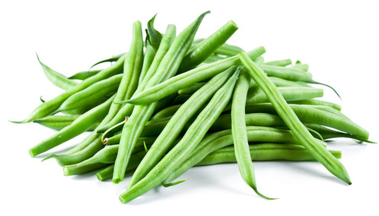 Pile of fresh green beans on a white background