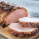 Pork loin roast sliced on a cutting board