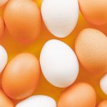 brown and white eggs in shells