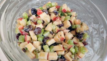 Waldorf salad made with grapes, apples, and nuts